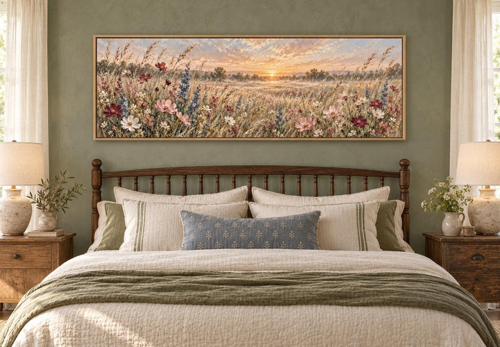 Wildflower Meadow Sunrise long narrow canvas wall art hanging above a bed in a rustic bedroom.