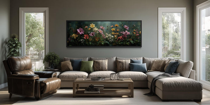 Wide horizontal canvas print of a wildflower meadow with a green background above a neutral sofa.