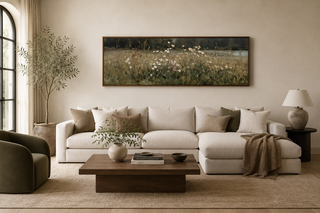 Long narrow wildflower meadow canvas art in a neutral living room above a white sectional sofa.