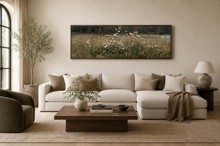 Long narrow wildflower meadow canvas art in a neutral living room above a white sectional sofa.