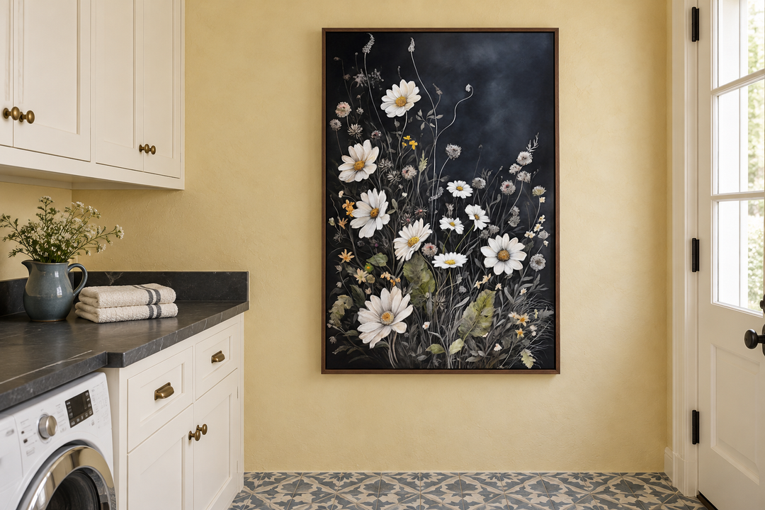 Black and white chamomile wildflowers framed canvas wall art in a laundry room with yellow walls.