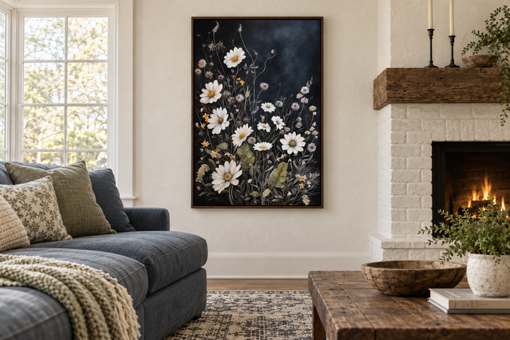 Black and white chamomile wildflowers framed canvas wall art in a cozy living room setting.
