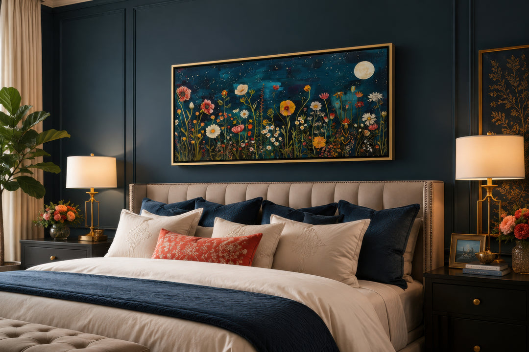 Large horizontal wall art of wildflowers in a field at night under a full moon above a bed.