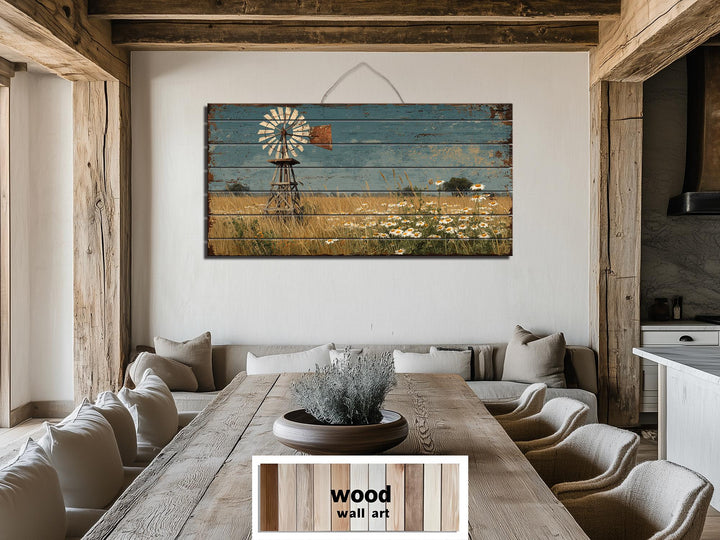 A horizontal wood wall art piece featuring a distressed windmill and wildflower field landscape.
