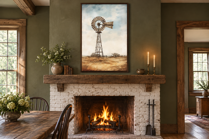 Framed windmill painting on canvas above a rustic fireplace in a farmhouse-style room.