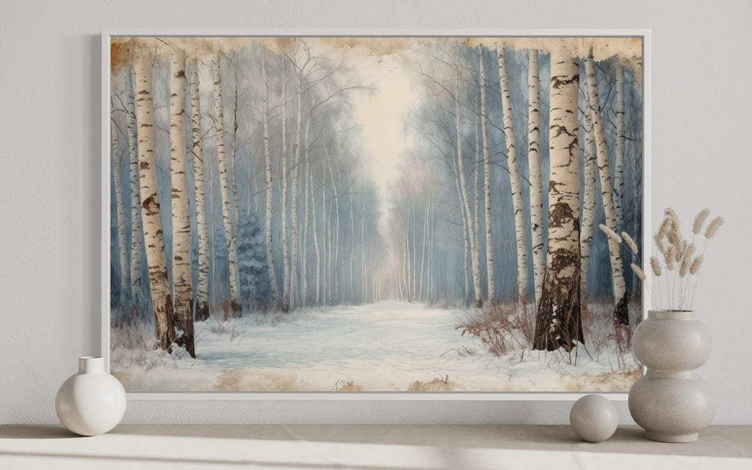 Winter Birch Trees Forest Landscape Framed Canvas Wall Art in a white frame on a neutral wall.
