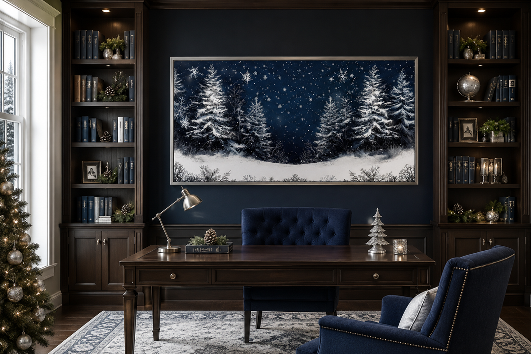 Framed canvas wall art of snow-covered pine trees at night in a dark blue office setting.