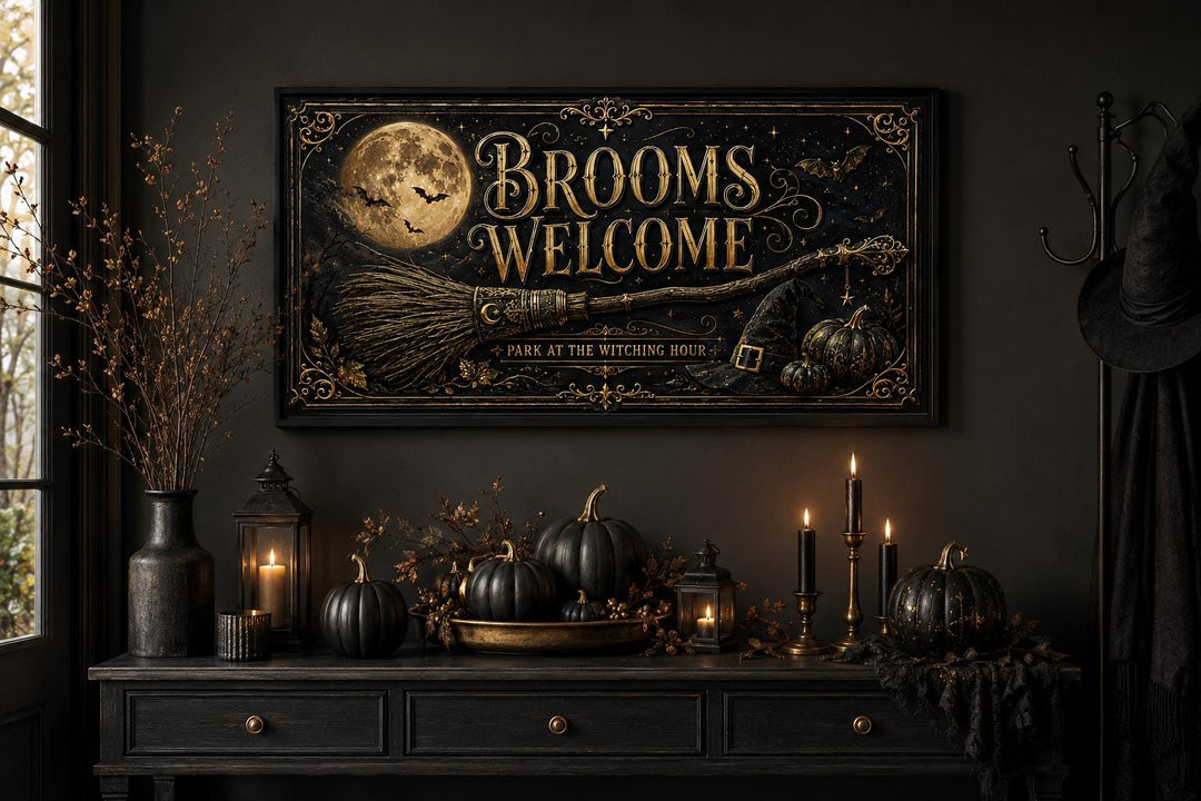 Brooms Welcome sign with a full moon and broom above a console with black pumpkins and candles.