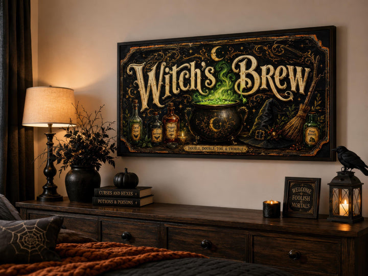 Vintage Witch's Brew canvas wall art with gold script and a glowing green cauldron on a black frame.