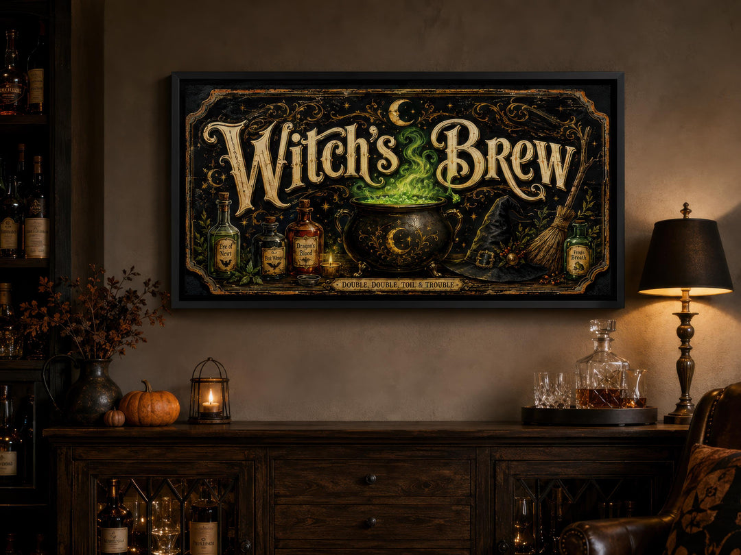 Witch's Brew vintage-style black and gold canvas print above a dark wood sideboard with pumpkins.