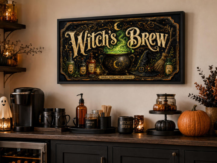 Vintage Witch's Brew canvas print with gold lettering and a glowing green cauldron in a black frame.