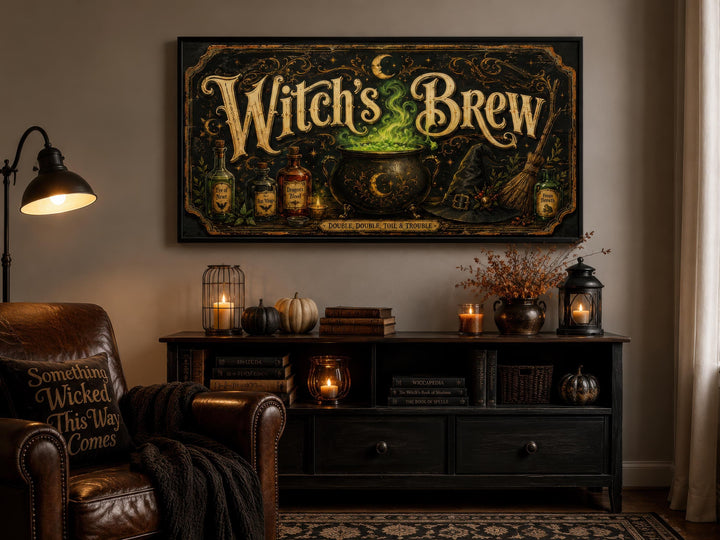 Vintage Witch's Brew canvas wall art with a glowing green cauldron above a black console table.