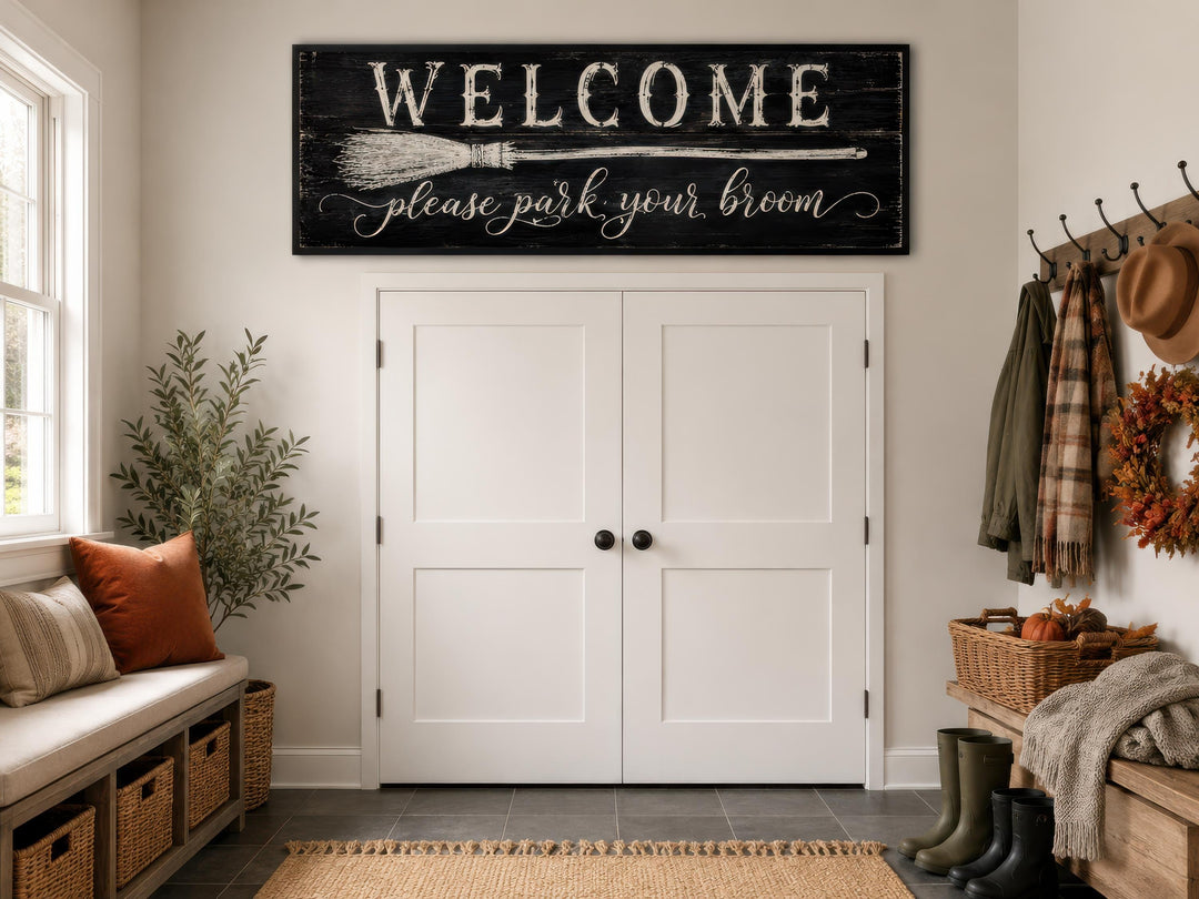 Witchy Halloween wall art sign reading "Welcome please park your broom" above a white double door.
