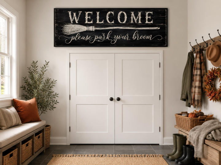 Witchy Halloween wall art sign reading "Welcome please park your broom" above a white double door.