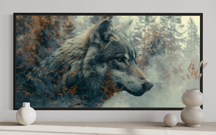 Wolf and forest double exposure canvas wall art in a black frame above a modern console table.