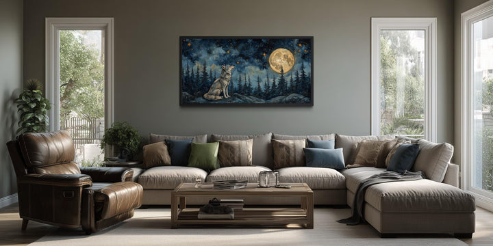 A horizontal canvas of a wolf howling under a full moon hangs above a sofa in a rustic living room.
