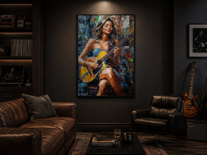 A large, colorful abstract painting of a woman playing guitar hangs in a dark, modern living room.