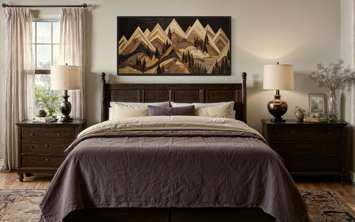 Framed canvas wall art featuring a geometric wood-textured mountain landscape above a bed.