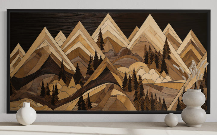 Framed canvas wall art featuring a geometric wood-effect mountain landscape in warm earthy tones.