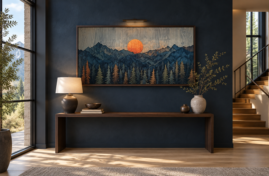Sunset over mountain and forest wooden effect framed canvas wall art above a console table.