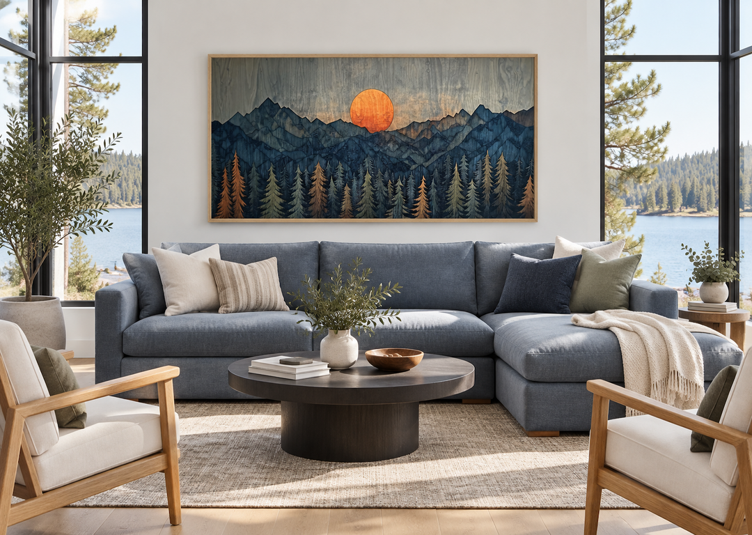 Sunset Over Mountain And Forest Wooden Effect Framed Canvas Wall Art above a blue sectional sofa.