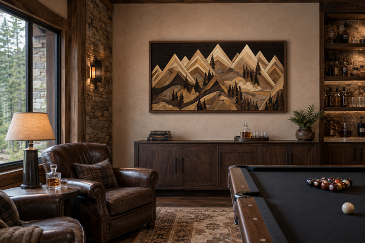 Framed wood-effect mountain canvas wall art in a rustic cabin living room with a pool table.