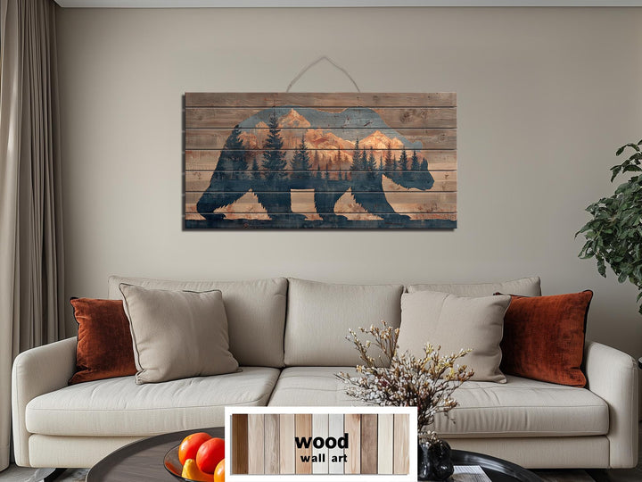 Wooden bear silhouette wall art featuring a mountain and forest scene on distressed wood planks.