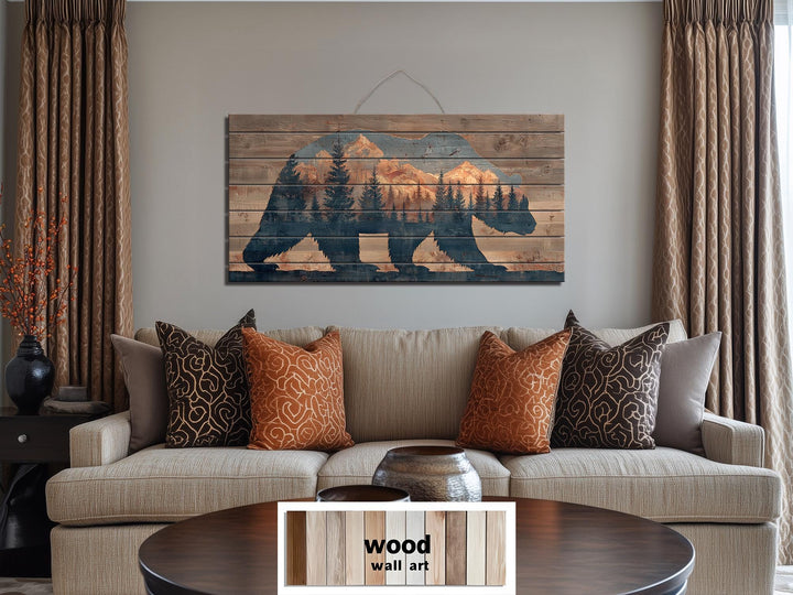 Wooden bear silhouette wall art featuring a mountain and forest scene on distressed wood planks.