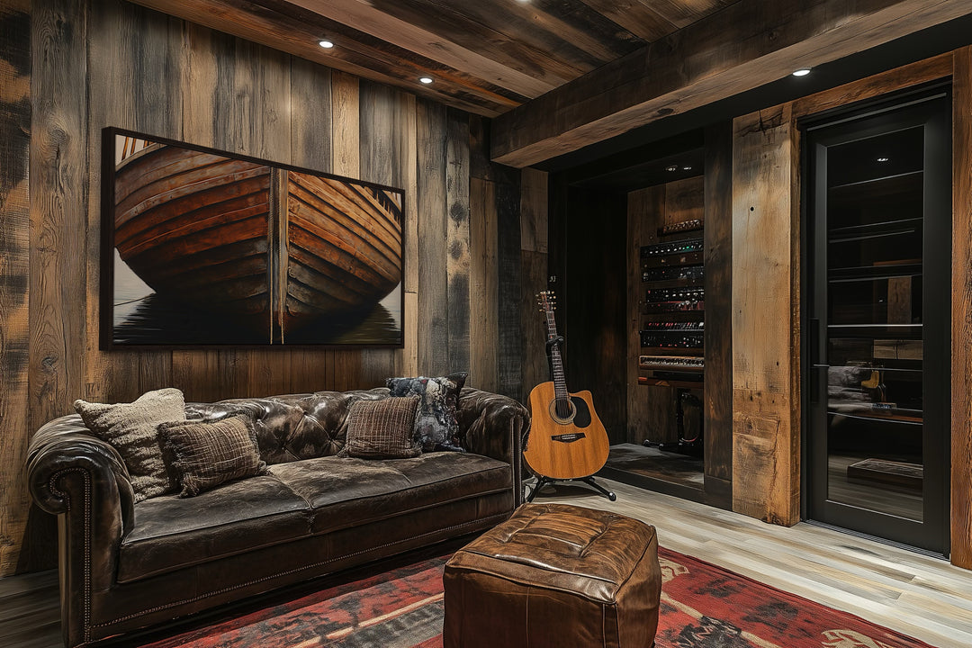 Framed canvas print of a rustic wooden boat on a dark wood wall in a cozy cabin living room.