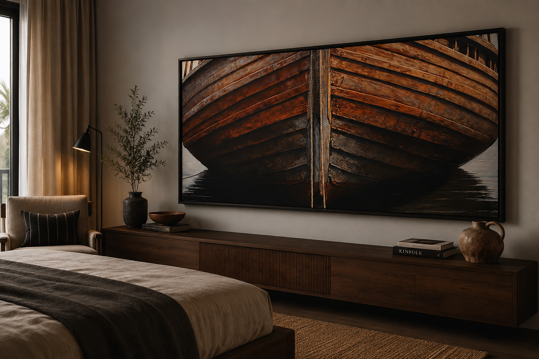 Large framed canvas print of a rustic wooden boat hull hanging above a dark wood media console.