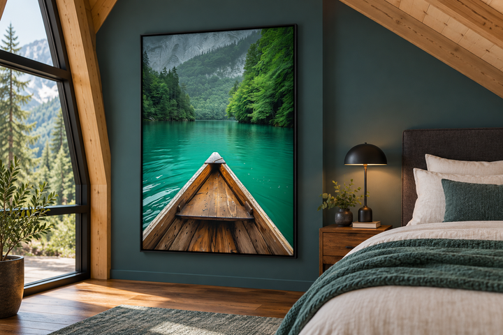Vertical framed canvas wall art of a wooden canoe on an emerald green lake in a bedroom setting.