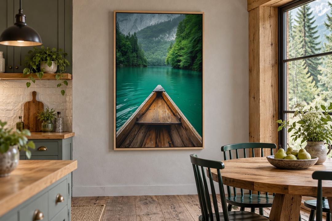 Vertical framed canvas wall art of a wooden canoe on an emerald green lake in a rustic dining room.
