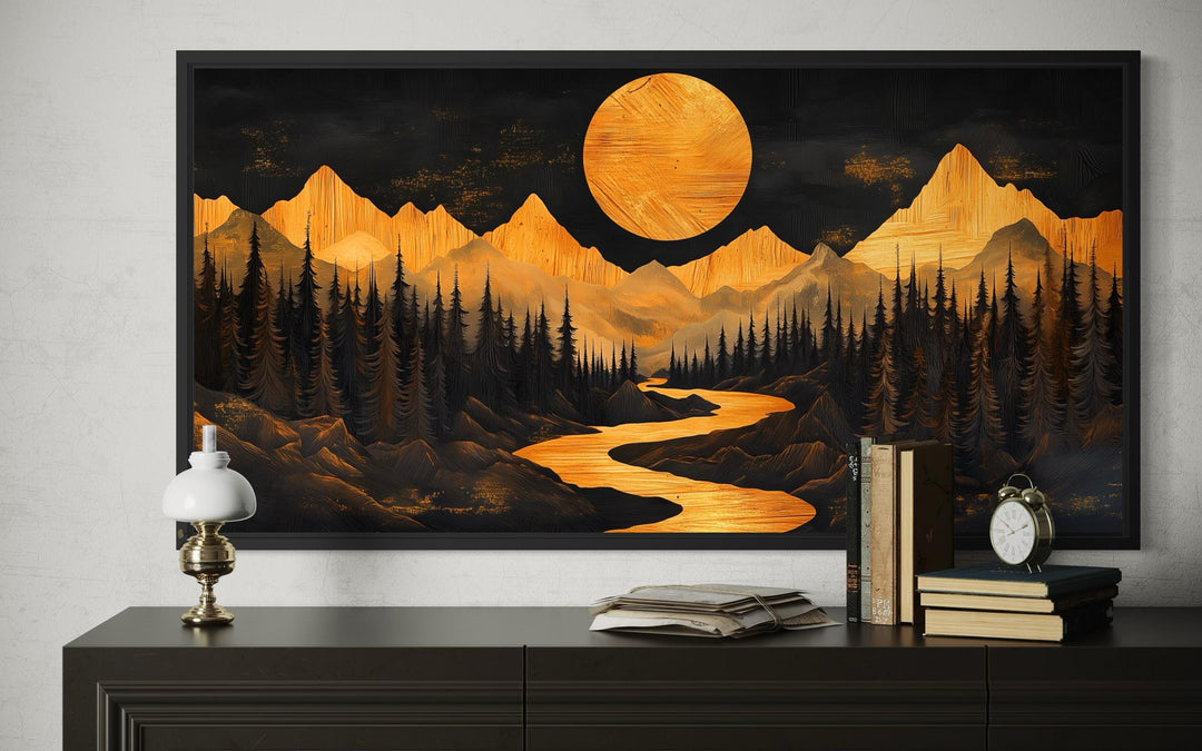 Framed canvas wall art of a golden mountain landscape and river under a glowing moon.