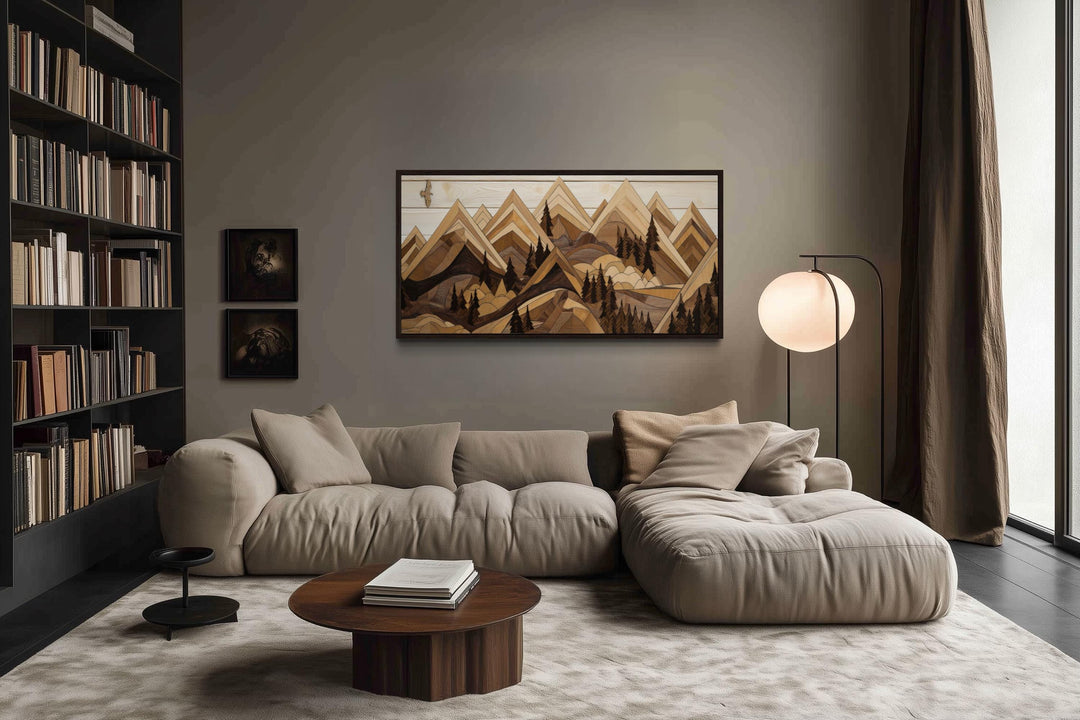 Wooden mountain with eagle framed canvas wall art in a rustic living room above a beige sofa.