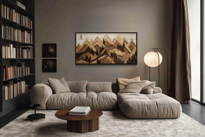 Wooden mountain with eagle framed canvas wall art in a rustic living room above a beige sofa.