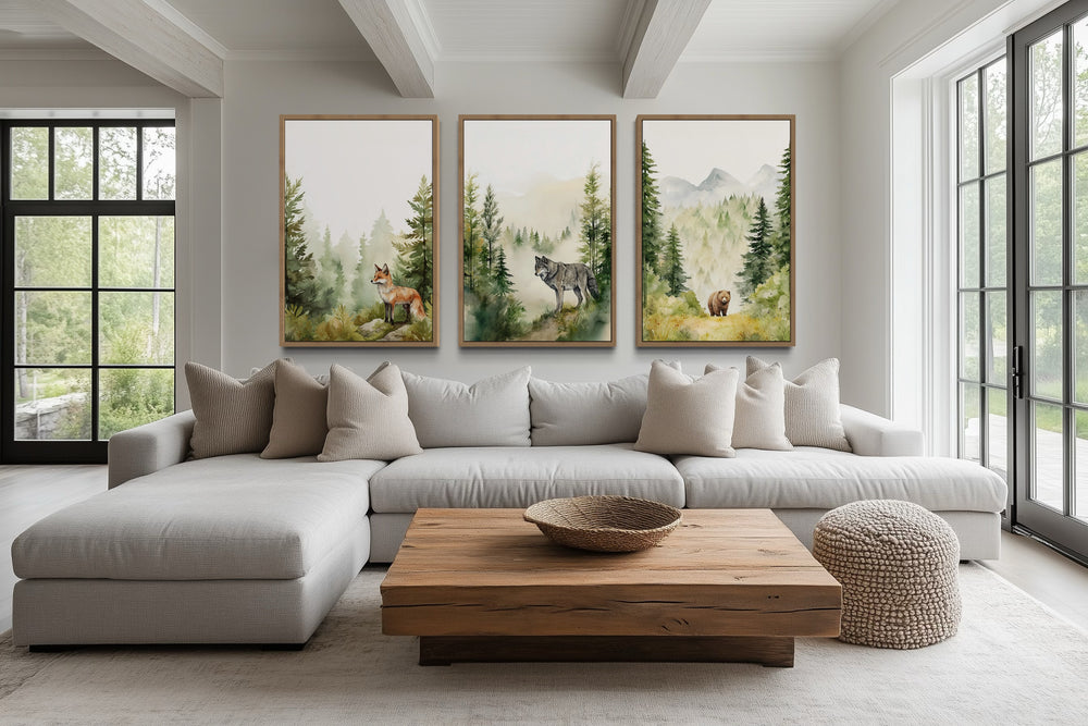 Set of three watercolor canvas prints featuring a fox, wolf, and bear in a misty woodland forest.