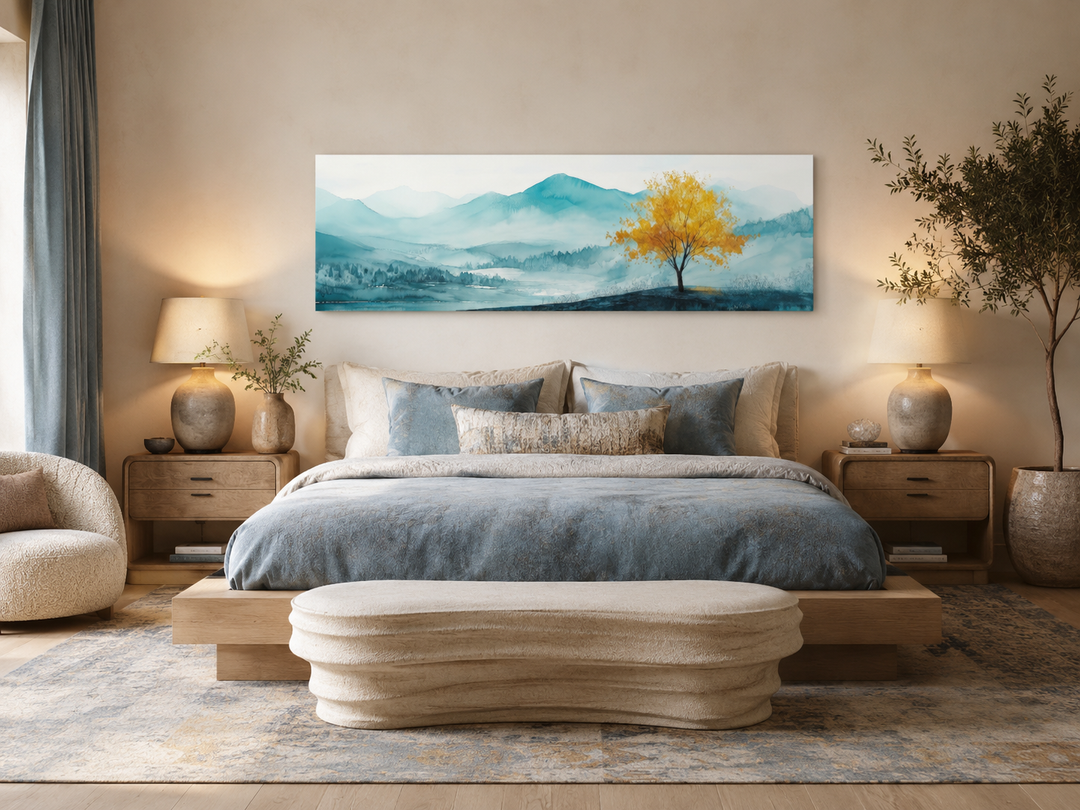 Yellow tree on teal mountain landscape long horizontal wall art above a bed in a modern bedroom.