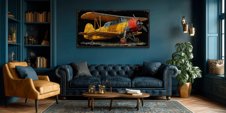 Yellow vintage biplane framed canvas wall art displayed in a moody, dark blue living room.