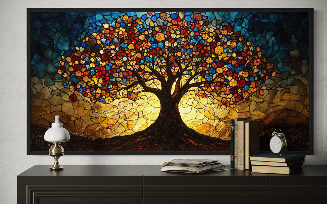 Yggdrasil framed canvas wall art in a vibrant stained glass style above a dark wood console table.