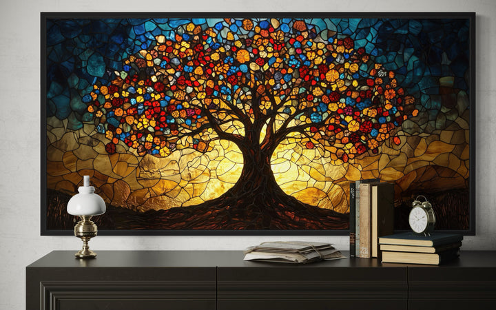 Yggdrasil framed canvas wall art in a vibrant stained glass style above a dark wood console table.