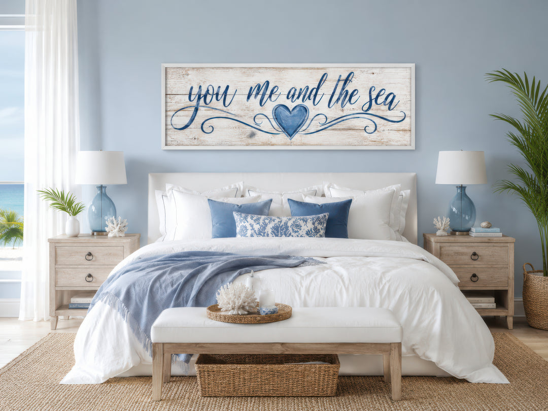 You Me And The Sea wall art in a coastal master bedroom with blue and white decor.