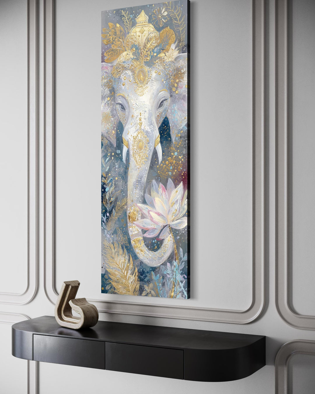 Vertical narrow canvas print of a white and gold Ganesha with a lotus flower on a paneled wall.