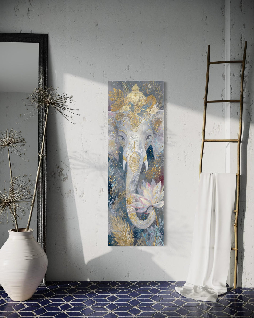 Vertical narrow canvas print of a golden Ganesha with a lotus flower on a white textured wall.