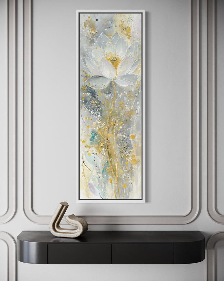Vertical narrow canvas print of an abstract white and gold lotus flower on a neutral wall.