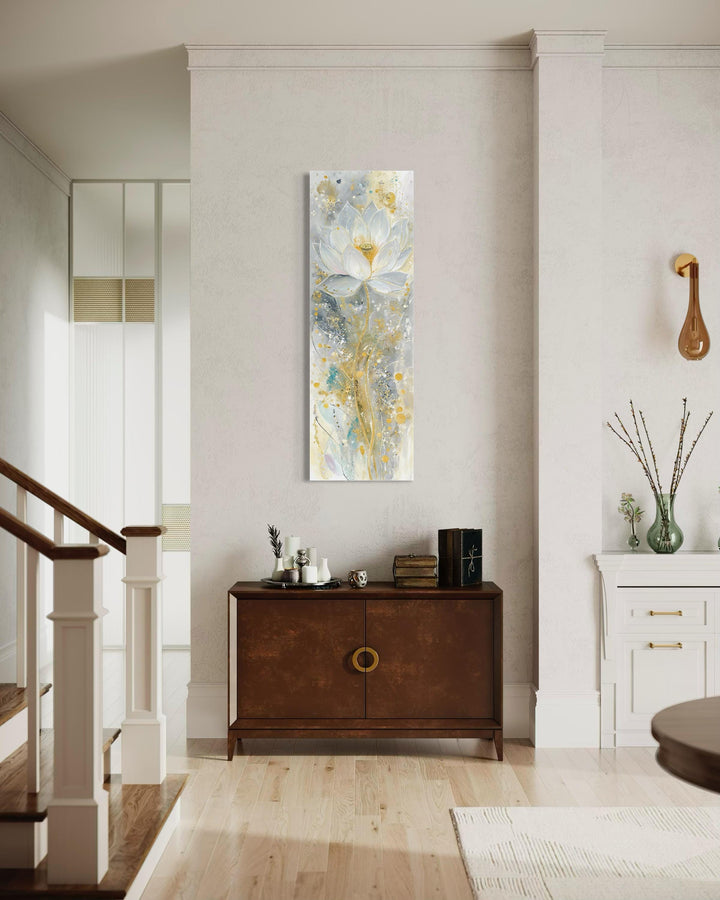 Vertical narrow canvas print of a Zen lotus flower in soft gold and gray tones on a neutral wall.