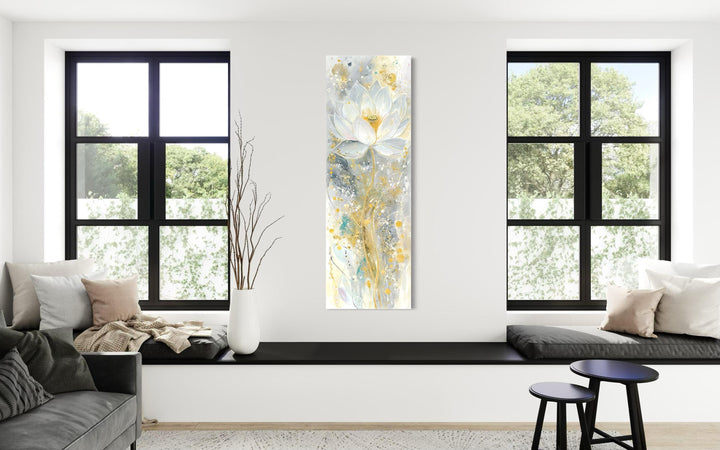 Vertical narrow canvas print of an abstract white and gold lotus flower in a modern living room.