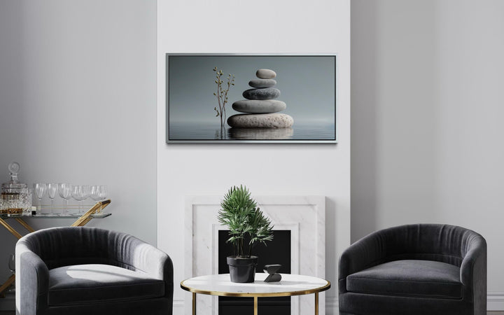 Zen stacked stones horizontal grey minimalist wall art displayed above a fireplace in a modern room.
