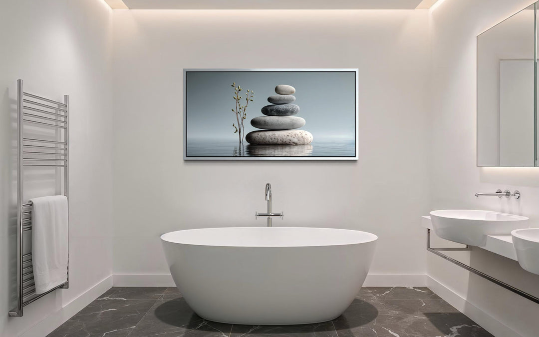 Zen stacked stones horizontal grey minimalist wall art displayed above a modern white bathtub.