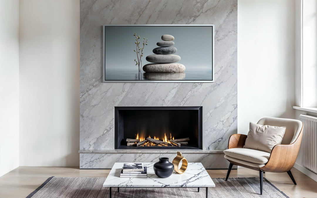 Zen stacked stones horizontal grey minimalist wall art displayed above a modern marble fireplace.