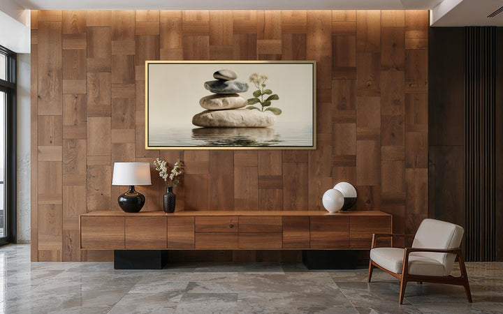 Zen stacked stones horizontal wall art with botanical accents in a warm, minimalist wooden room.